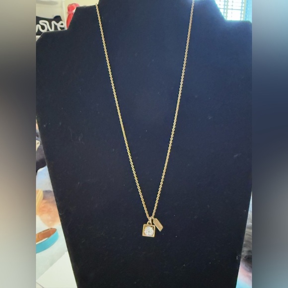 Coach gold tone necklace. Dangly gem with gold around with coach tag. - Picture 2 of 6